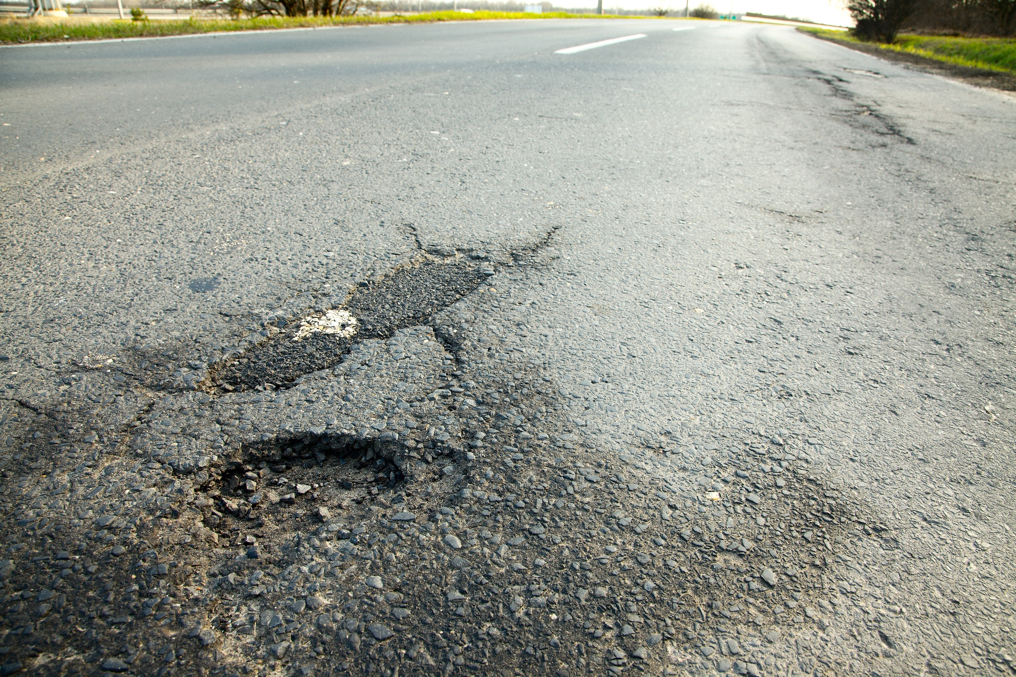 Pothole crack on the road surface